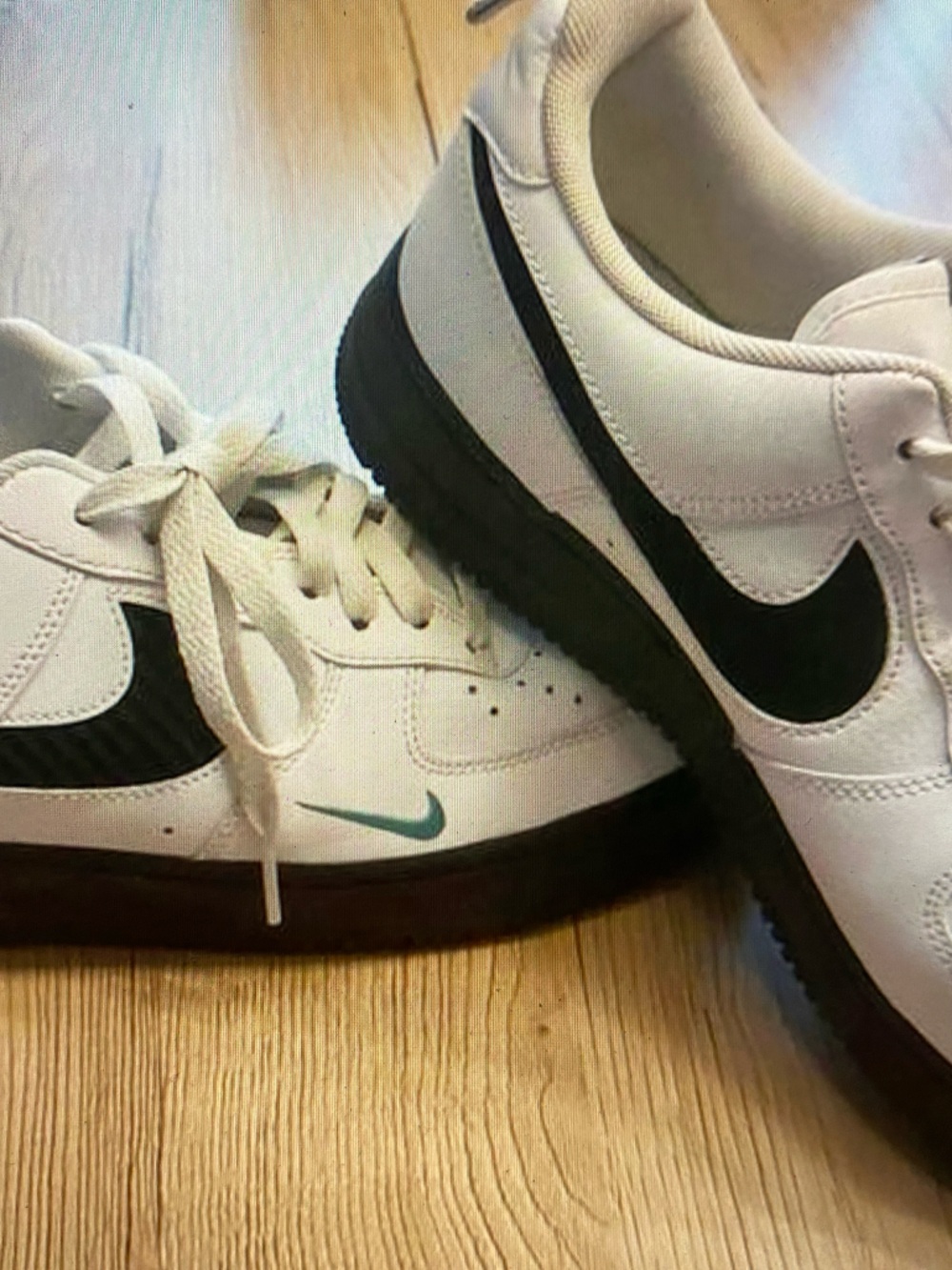 Nike Men’s White Sneakers with Black Swoosh and Teal Accent